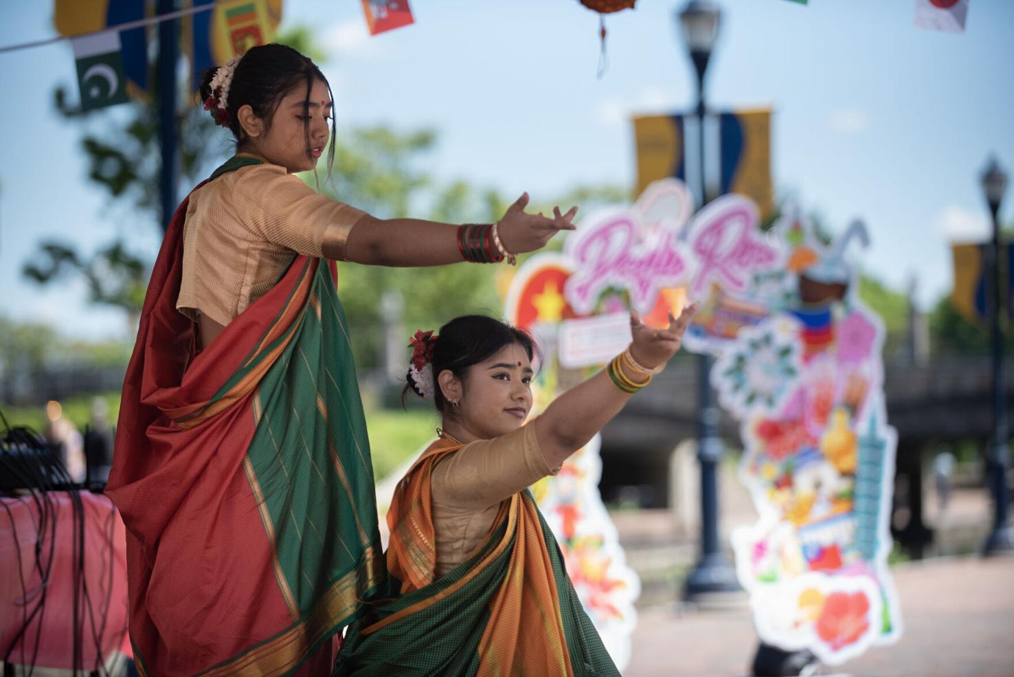 Parissa Shabbir, left, and Raisa Fahreen perform a dance as part of the Asia on the Creek in Frederick in 2023.